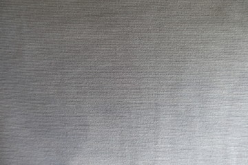 Fototapeta na wymiar Light grey thin jersey fabric from above