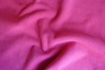 Rippled bright ruby red polar fleece fabric