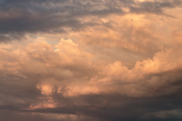 storm clouds in the sky, illuminated by the evening sun. Beautiful natural background.