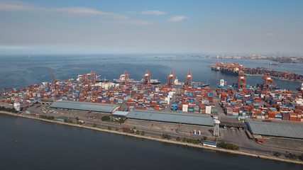 Aerial view industrial cargo port with ships and cranes. View of the cargo port and container...