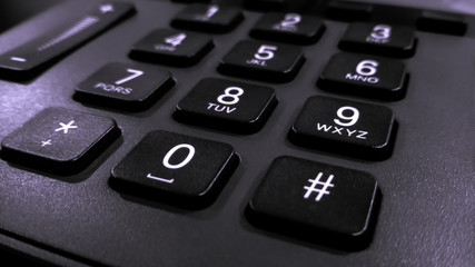 close up on the numbers on the keypad phone, fixed phone
