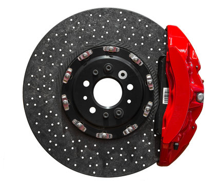 Ceramic disc brake with red caliper isolated on a white background