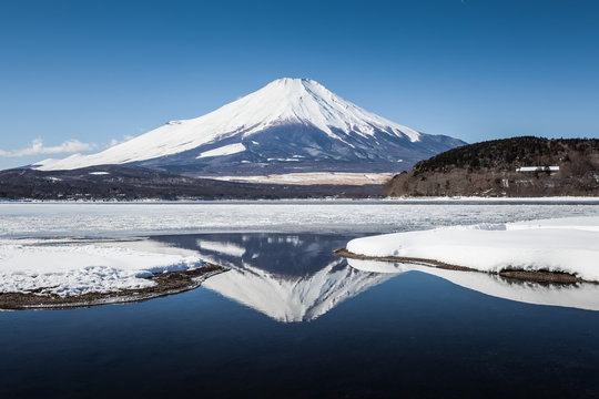 Mountain Fuji with reflection and Yamanakako ice lake in winter