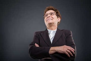 Low angle of business senior lady posing