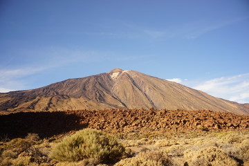 Fototapeta na wymiar The Teide volcano in Tenerife. Spain. Canary Islands. The Teide is the main attraction of Tenerife. The volcano itself and the area that surrounds it form the Teide national Park.
