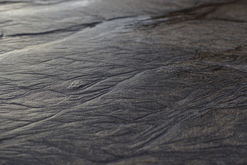 close up of black rough Sandpaper sheet texture use as Background