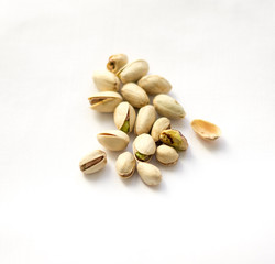 Dry roasted pistachios on the white background