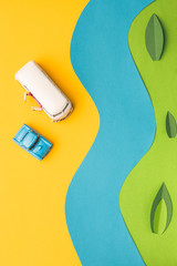 Vintage miniature car and bus in trendy color, travel concept