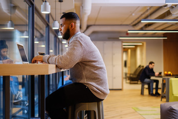 Young specialists in coworking office