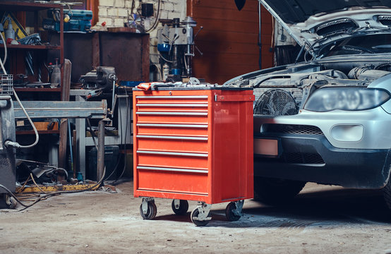 Red tool box in a garage.