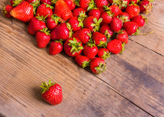 Fresh red strawberry on wood background