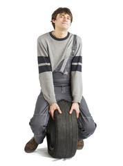 Fototapeta premium A young brunet foreman in working grey uniform with black wheel.