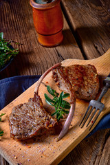Grilled lamb chops an old board