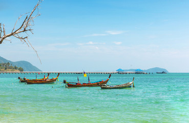 Fototapeta na wymiar Andaman Sea with traditional longtail boats Rawai