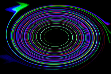 Abstract colorful circles glow over black
