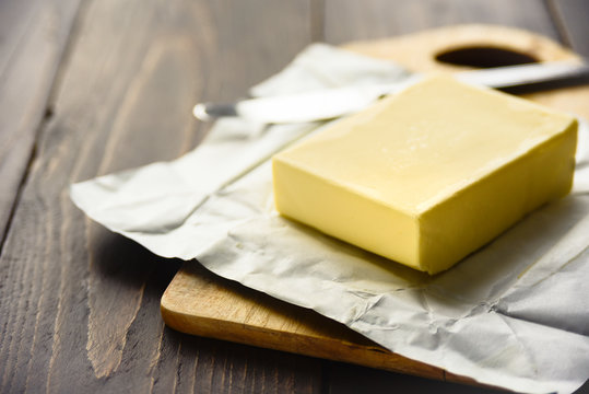 Pat of fresh farm butter with a knife