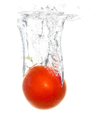 Red tomato under water on a white background