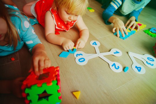 kids learning numbers, calculations, play with puzzle