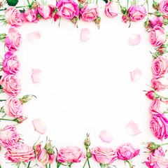 Floral frame of pink roses and petals on white background. Flat lay, Top view.