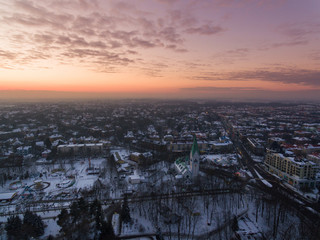 Aerial: The Kaliningrad Puppet Theatre in a public park in winter at sunset