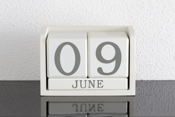 White block calendar present date 9 and month June