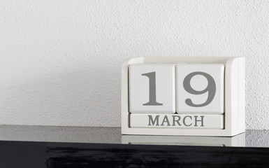 White block calendar present date 19 and month March