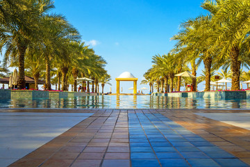 The luxury swimming pool with sunbeds