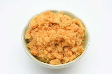 Dried shredded pork in  bowl  on white background.
