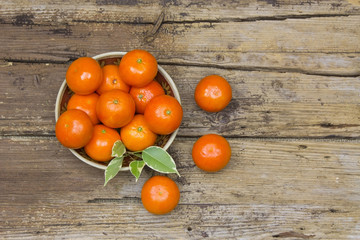 Naklejka na ściany i meble fresh tangerines in a bowl