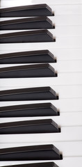 black and white piano keys closeup