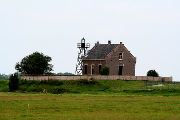 Fototapeta na wymiar Former dwelling of the lighthouse keeper on the former island of Schokland