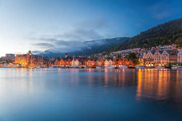 Fototapeta na wymiar Bergen street at night with boats in Norway