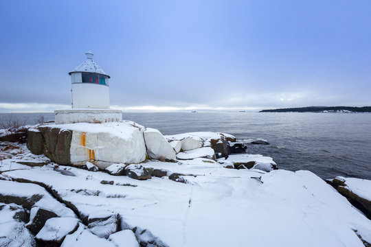 Lighhouse at Baltic sea coast in winter, Sweden