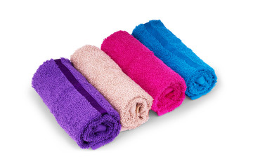 Colorful towels rolls isolated on white background.