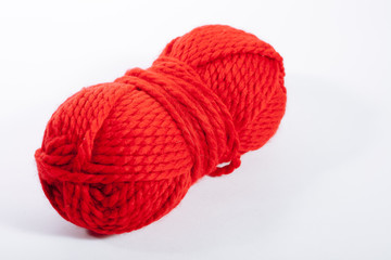 Woolen red thread, for knitting.