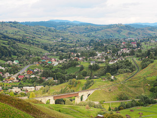 Carpatian mountains village at green forest