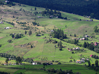 Carpatian mountains village at green forest