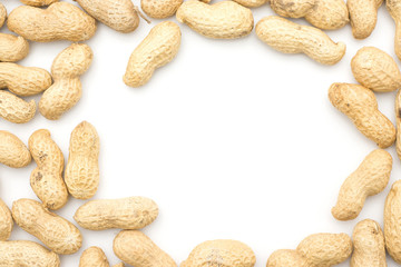 Unshelled peanuts top view isolated on white background.