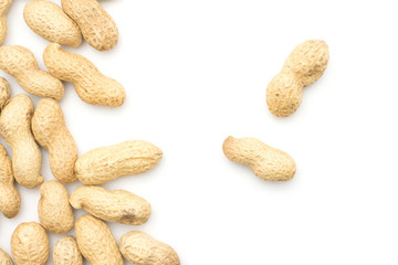 Unshelled peanuts top view isolated on white background left side two in the middle.