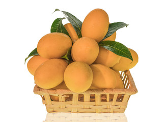 Sweet Marian plum in a bamboo basket isolated on white background with clipping path