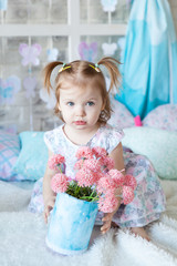 Fototapeta premium Cute girl in a spring studio