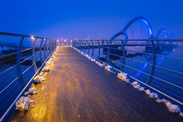 Solvesborgsbron pedestrian bridge at dusk in Sweden. At 756 meters the longest pedestrian bridge in Europe.