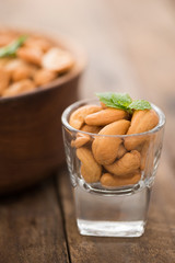 cashew nuts in wood bowl on old wood table