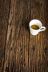 White coffee cup on rough wooden table