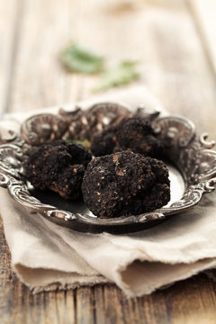 Black truffles on plate.