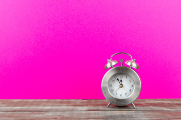 alarm clock with pink background