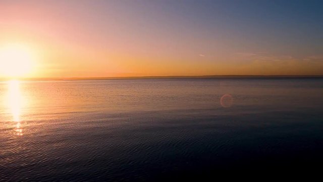 Seamless loop sanset on water of river/sea