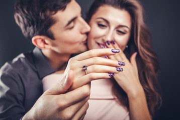 Proposal of marriage. Closeup of a female hand with a ring.