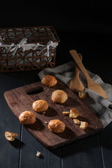 Small snack cheese bread with black wooden
