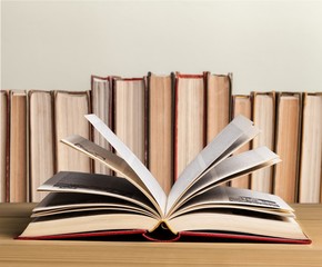 Open book on wooden table